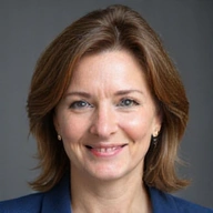 Portrait of a female executive with a friendly and engaged demeanor.